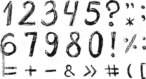 Collection of hand drawn numbers symbols and punctuation marks in black ink