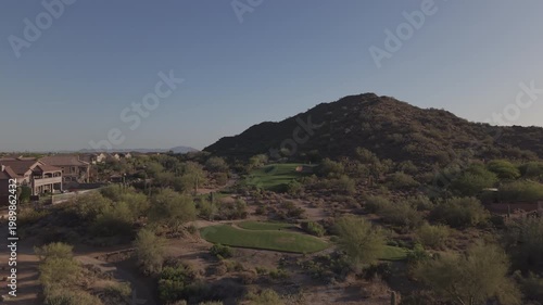 An aerial view of a mountainous golf course in Arizona during the spring.