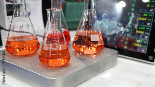 Sciene laboratory. Close up of Modern laboratory scenes with glassware tube reactors and colorful liquids in testing and analysis processes. Chemistry research pharmaceuticals biotechnology concepts.