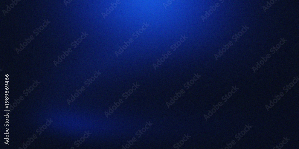 Obraz premium A dark canvas with a vibrant blue glow at the top center