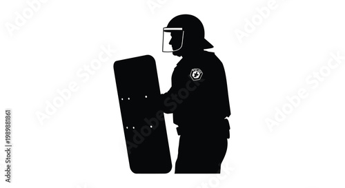 Silhouette of a riot police officer holding a shield and wearing a helmet