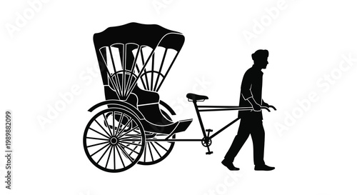 A silhouetted rickshaw puller walks along a path transporting a passenger
