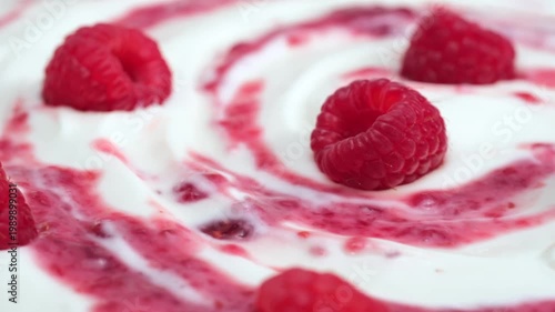 Fresh raspberry on creamy yogurt surface macro minimal composition, copy space