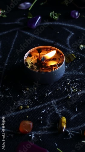 Vertical video, Black magic ritual background with magical altar, candles, crystals and herbs. Sorcerer rite of witchcraft and occultism. Halloween occult, esoteric and divination concept.