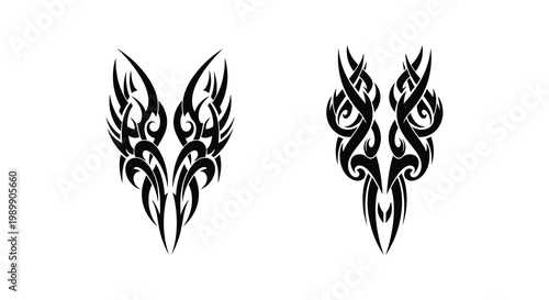 Two symmetrical black tribal wing designs detailed and artistic silhouette