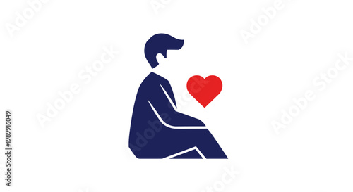 a man sitting with a heart.