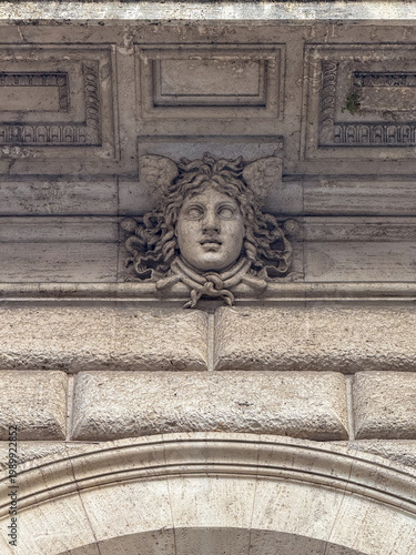 Stone Medusa relief on Bank of Italy facade - Rome, Italy