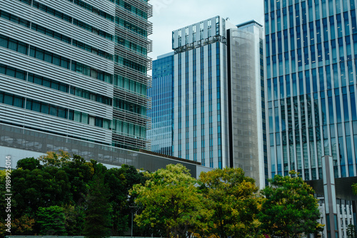 Modern office buildings with green park, Japan