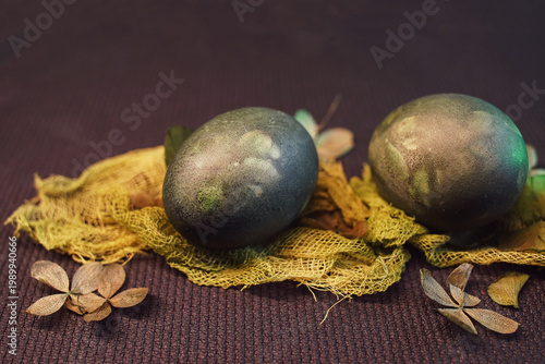 Natural Easter decoration with dried petals, colored egg