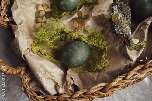Naturally dyed botanical Easter eggs in a rustic woven basket