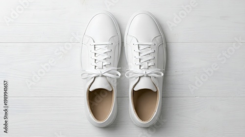 Modern white sneakers on wooden floor stylish casual footwear fashion and lifestyle concept comfortable design