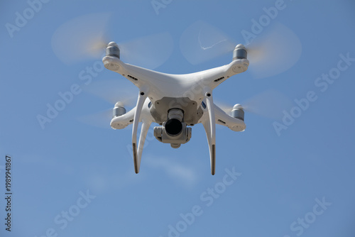 Drone ascends into a blue sky