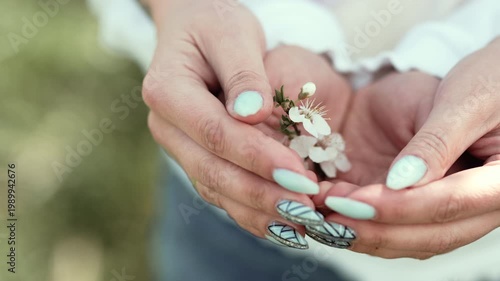 Sustainable Future: Young Child and Mother Hands Caring for Spring Nature