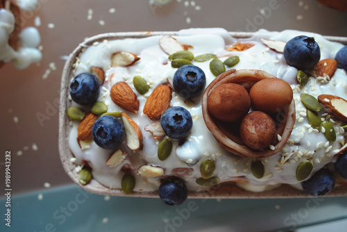 Easter cake decorated with cream, berries, and seed decoration