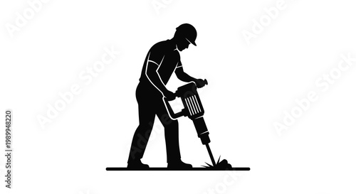 Construction worker operates a jackhammer depicted in a striking black silhouette