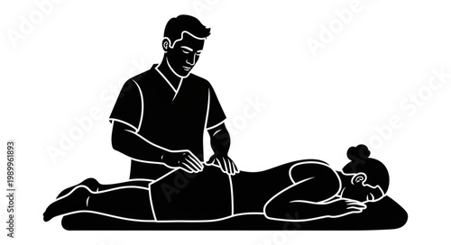 Physical therapist performing massage on patients lower back.