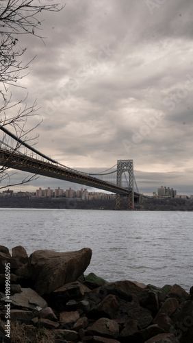 Dramatic View of the George Washington Bridge Over the Hudson River on a Cloudy Day