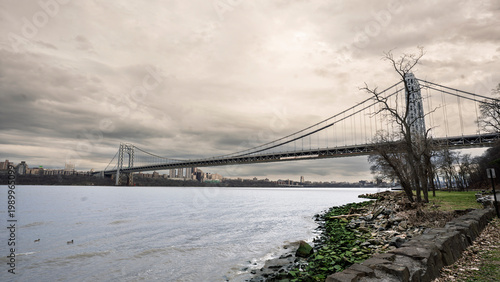 George Washington Bridge spanning the Hudson River under an overcast sky