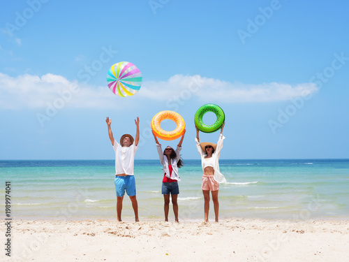 young teen playing and running on the beach