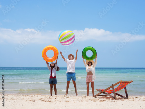 young teen playing and running on the beach
