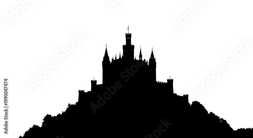 Medieval castle silhouette with towers and spires on a hilltop