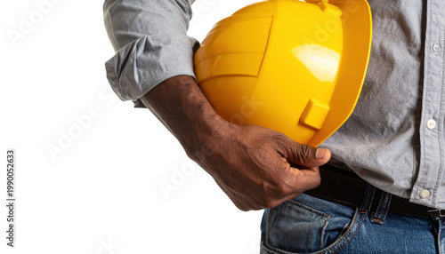 Man Holding Yellow Hard Hat at Construction Site
