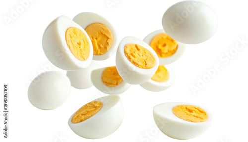 Sliced Hard Boiled Eggs Floating on Black Background