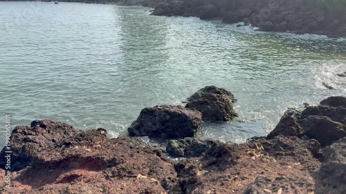 Beautiful 4K view of sea waves crashing against rugged rocks near Karhateshwar Mandir. Coastal breeze, endless blue waters, and serene Konkan beauty create a mesmerizing scene.