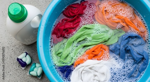 Vibrant Laundry Soak: A Colorful Array of Garments Bubbling in Wash Solution, Domestic Chore, Cleanliness, Textile Refreshment