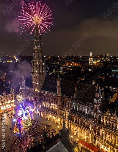Aerial view of a lively city square at night with fireworks