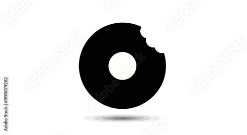 A large black bitten donut sits on a gray shadow on a white background.