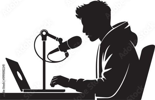 Young man creating content at his desk with a laptop and microphone, podcasting at home