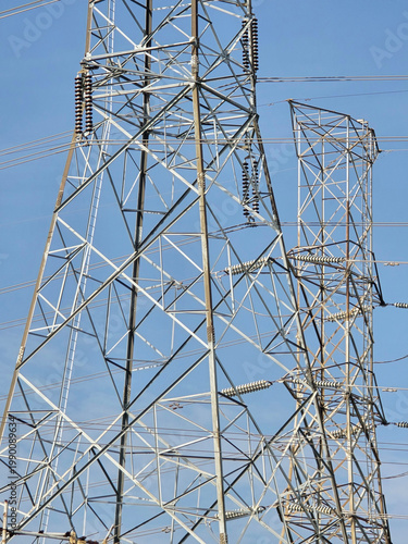 power lines and high voltage tower against the sky