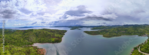 Aerial view of Tag-Abaca coastline and inlets on Dinagat Island under dramatic cloud cover