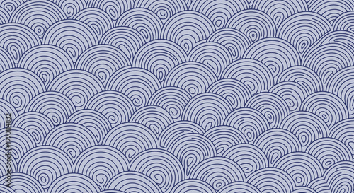 Traditional japanese seigaiha wave pattern in shades of blue featuring concentric circles and swirling line details.