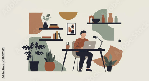 Man working on laptop at desk in a modern home office.