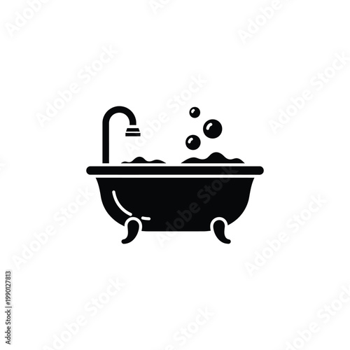 A person relaxes in a bubble bath with water pouring from a faucet.