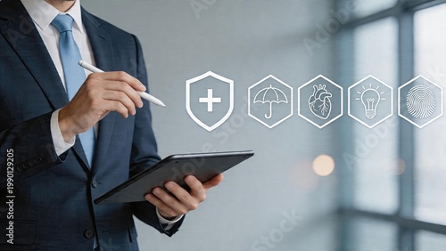 Businessman holding tablet digital pen writing in air with floating security icons including shield medical cross umbrella heart light bulb fingerprint Modern technology office