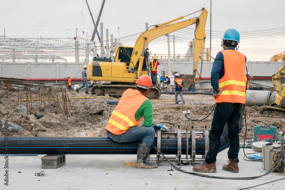 Fototapeta premium Construction worker connect HDPE pipe in construction site