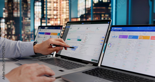 Photos Hispanic ERP Expert Evaluating Cloud-Based CRM And Marketing Software