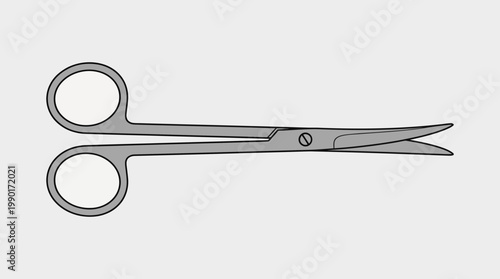 Surgical scissors on a gray background