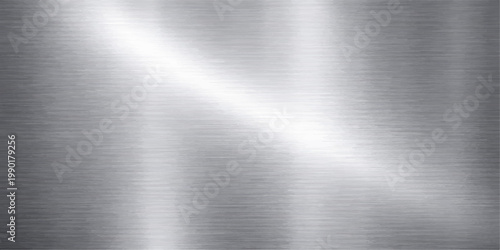 Industrial silver brushed metal texture background with a polished stainless steel plate surface showing a shiny grey metallic pattern and light reflection on an aluminum backdrop material