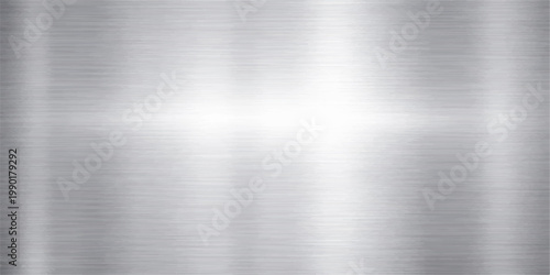 Shiny silver stainless steel plate with a polished brushed metal texture and a grey industrial aluminum surface pattern for a sleek metallic backdrop