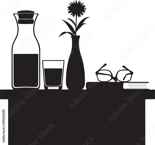 Black and white still life with flower vase glasses and table