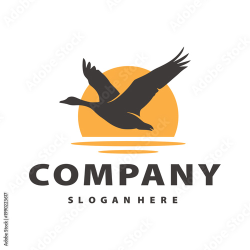 Flying Goose Silhouette over Sunset Sun and Water Vector Logo Illustration