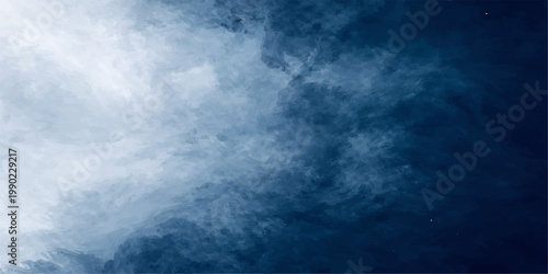 Dramatic white clouds drift through a bright blue summer sky creating an abstract nature background with a light cloudscape and heavenly day weather