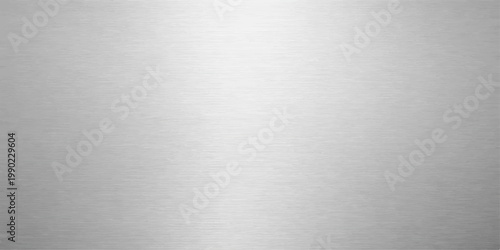 A seamless brushed metal background featuring a textured silver steel plate surface with a shiny metallic aluminum pattern and grey iron alloy reflections for a professional stainless backdrop