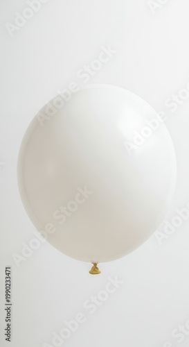 White Balloon Floating Against a Bright Background.