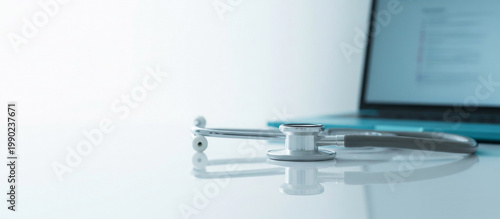 Foto Medical stethoscope on desk with laptop screen technology healthcare concept abstract