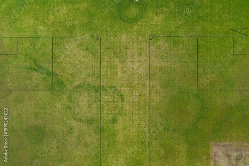 Tableau sur toile Aerial drone view directly above sports playing field at Maitland Park Sportsground in Maitland, New South Wales, Australia showing painted field markings on green grass surface